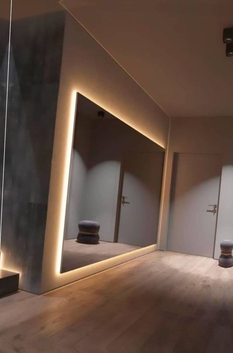 Backlit mirror wall by AJR Glass