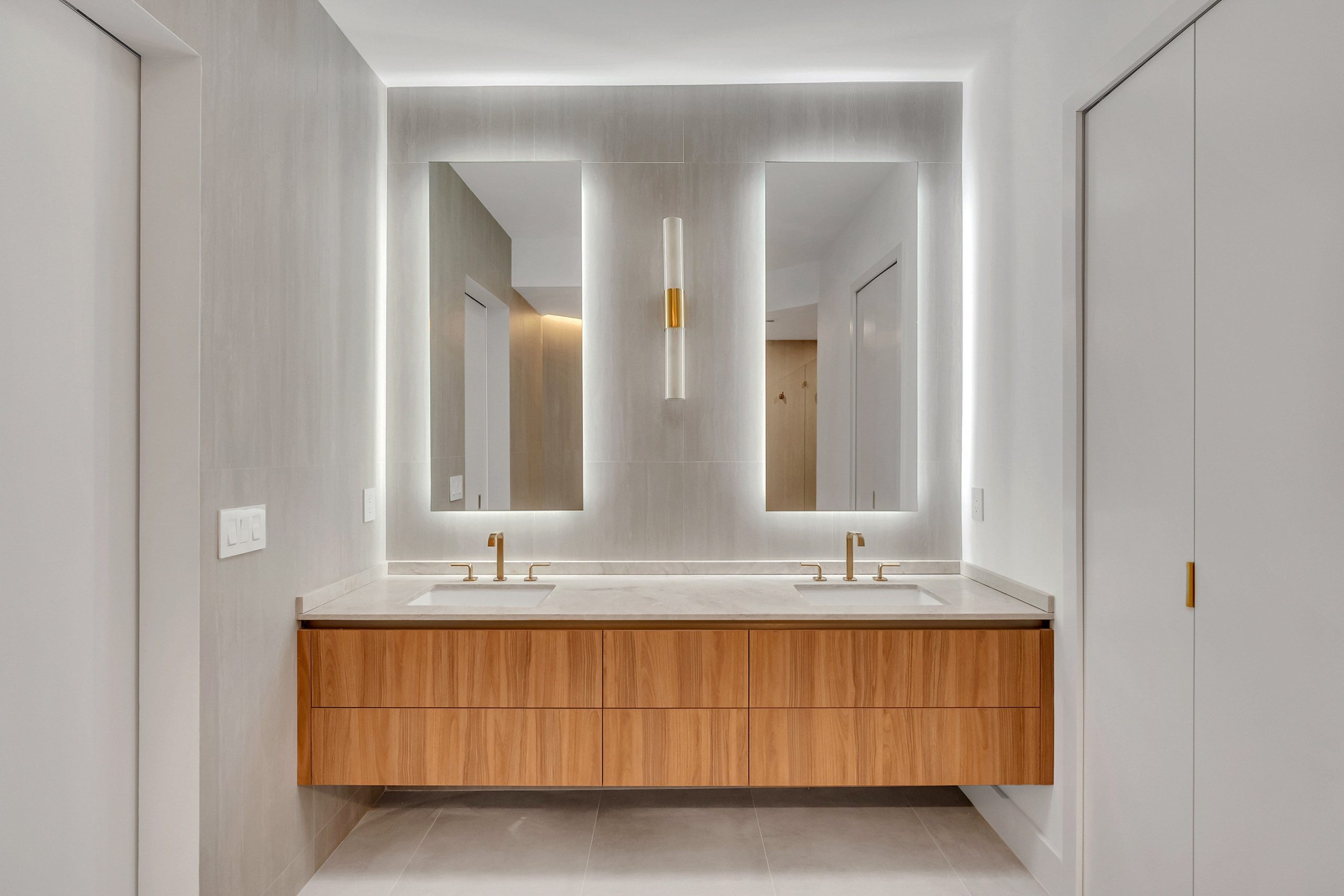 Twin backlit mirrors at Mystic Pointe